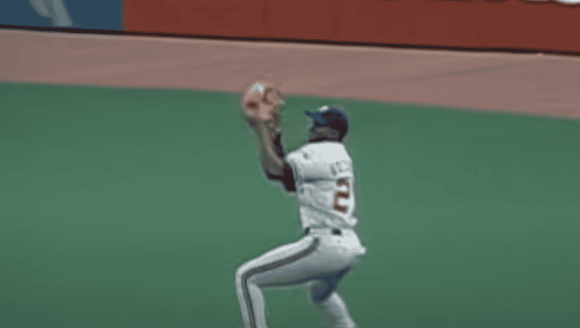 Vladimir Guerrero hitting a pitch, showcasing his skills as a renowned bad ball hitter.